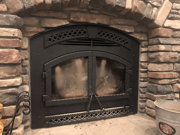 Why is the glass on my fireplace black?